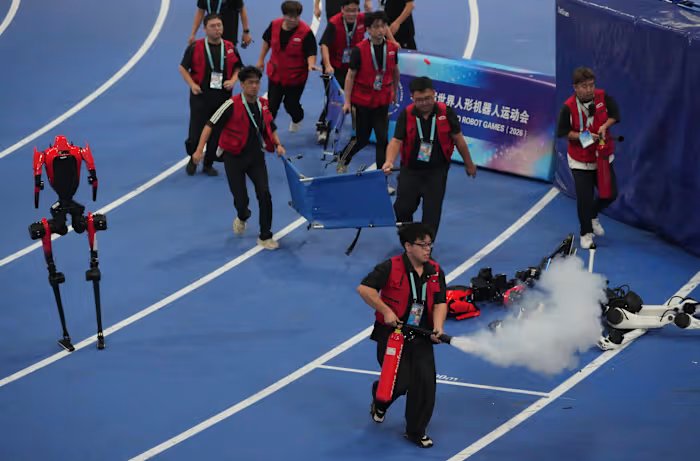 A robot sprinter shatters a 100-meter record again as sparks fly at China’s robot competition
