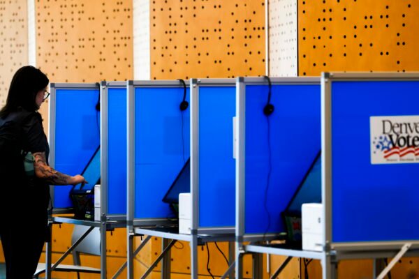 It’s illegal for armed federal officers to be at polls. Lawsuits seek to ensure that